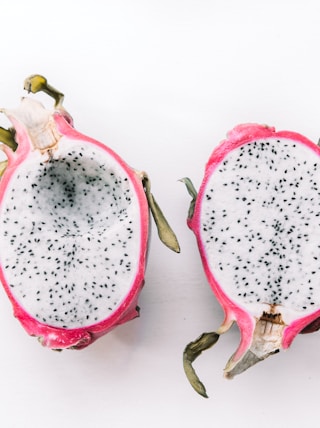 two sliced dragon fruits