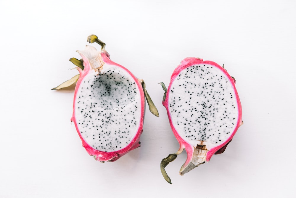 two sliced dragon fruits