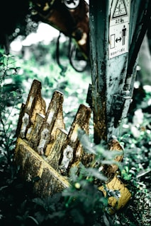 Repaired and refurbished machine bucket showing smooth welds and fresh paint.