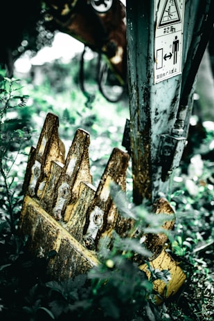 Repaired and refurbished machine bucket showing smooth welds and fresh paint.