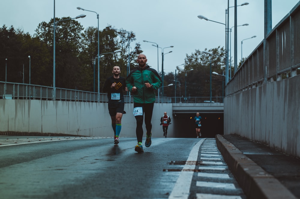 group of people running on street