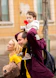 smiling man carrying toddler beside smiling woman