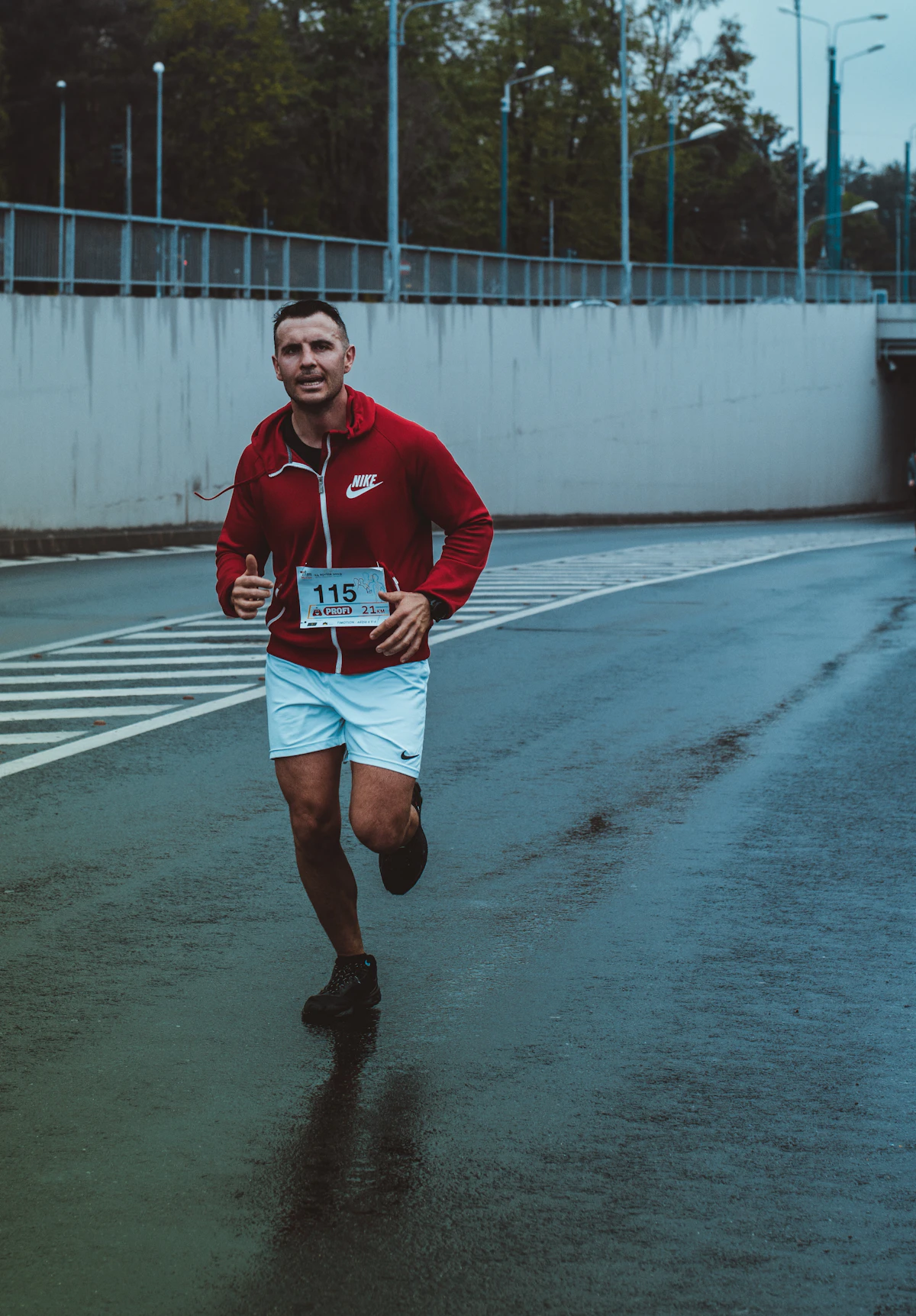 Middle-aged man running outdoors on a sunlit road, illustrating cardiovascular exercise as a key intervention for heart disease and erectile health.