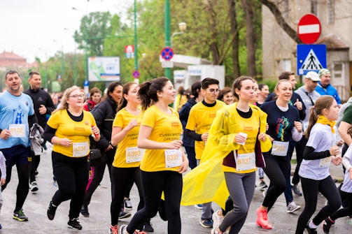 men and women running on street