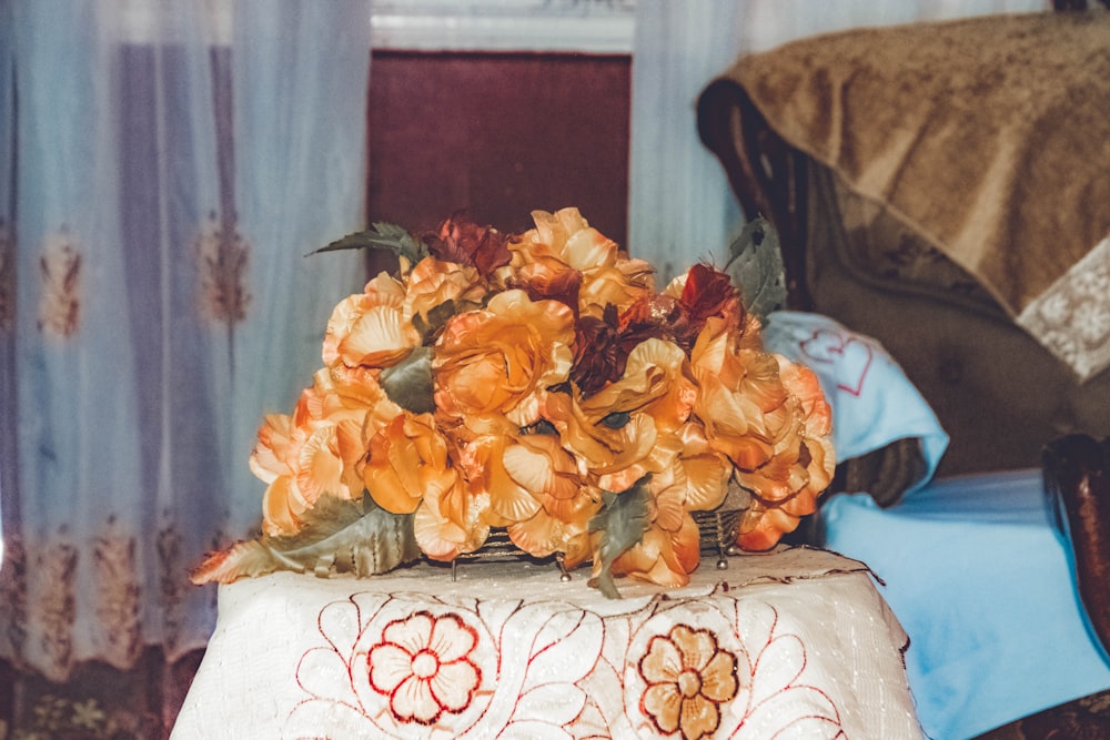 orange flower on table