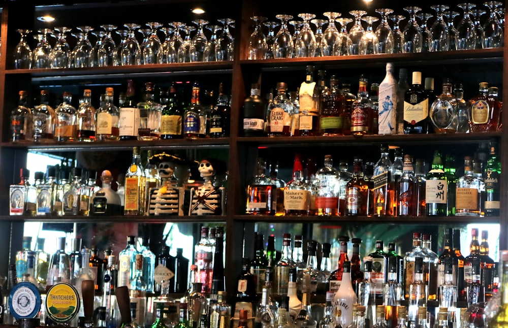 varieties of winery on brown wooden shelf