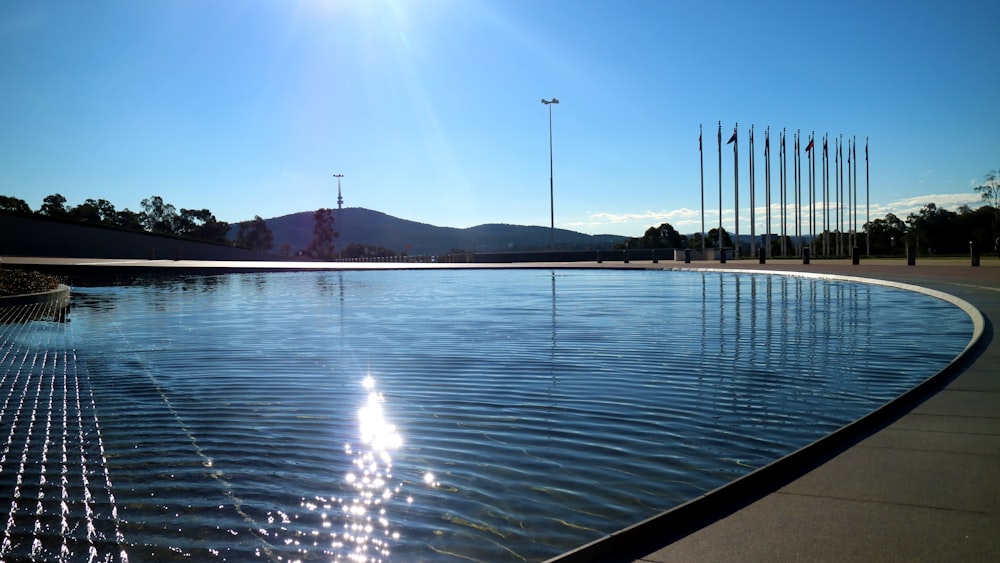 calm water under blue sky