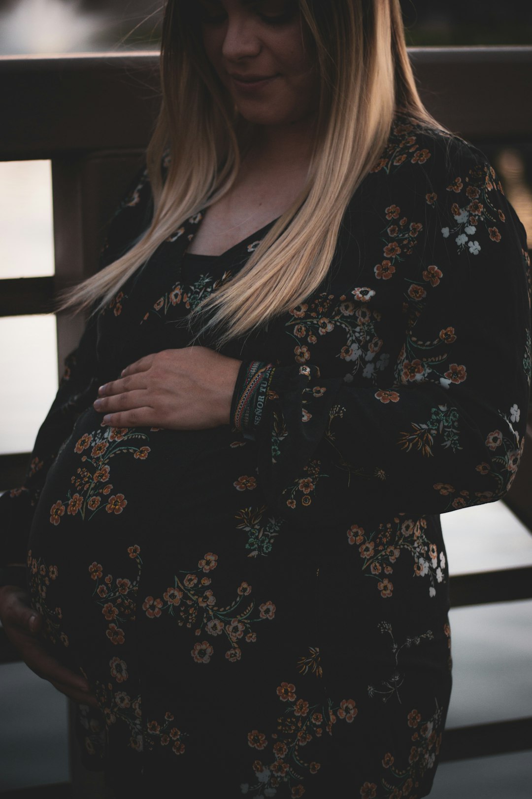 mother holding her tummy