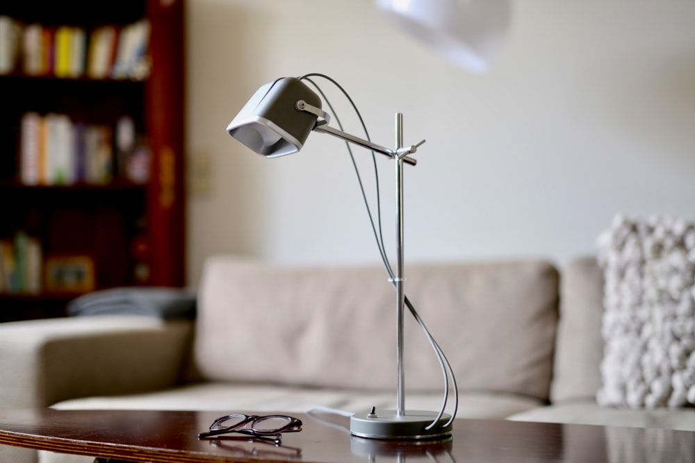 turned-off desk lamp on brown table