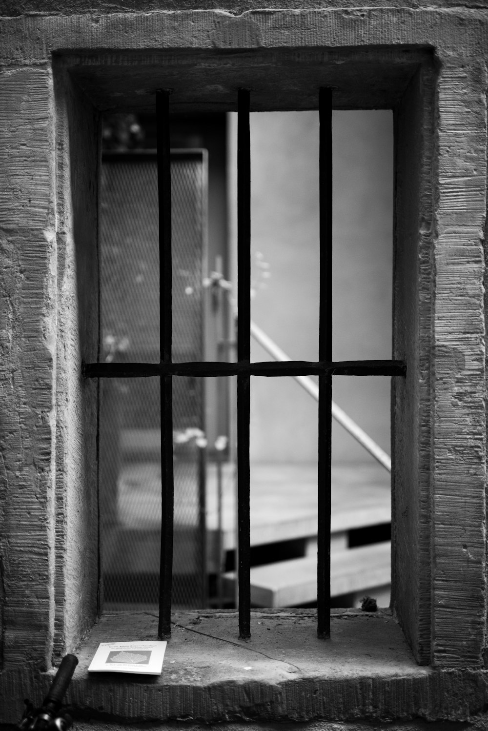 grayscale photography of black metal window