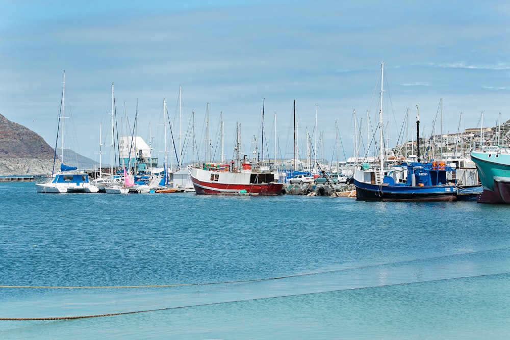 multicolored boats under clear blue sky