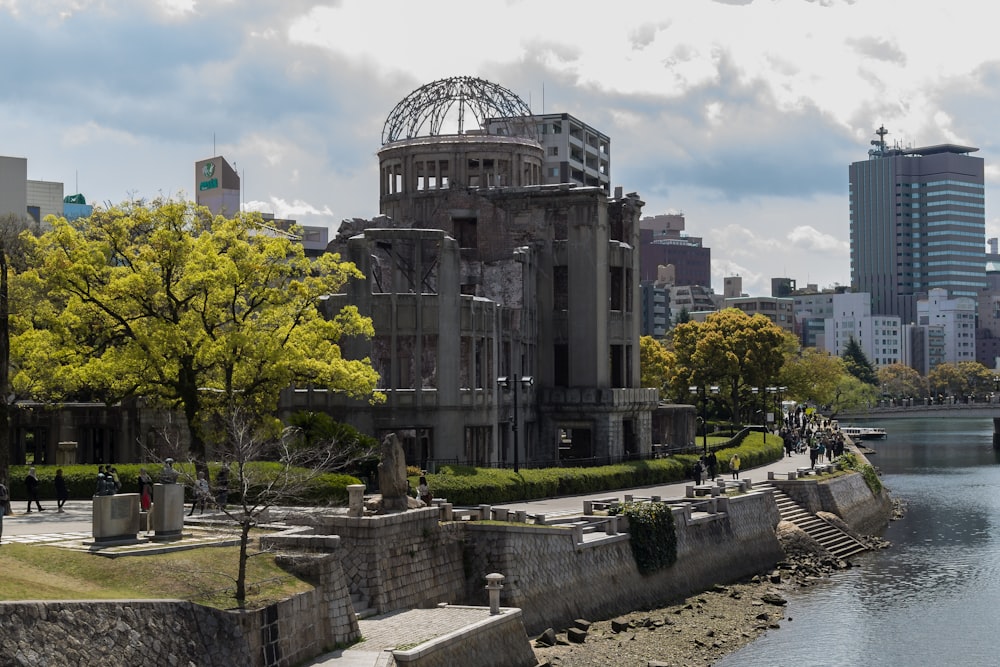 gray concrete building near body of water