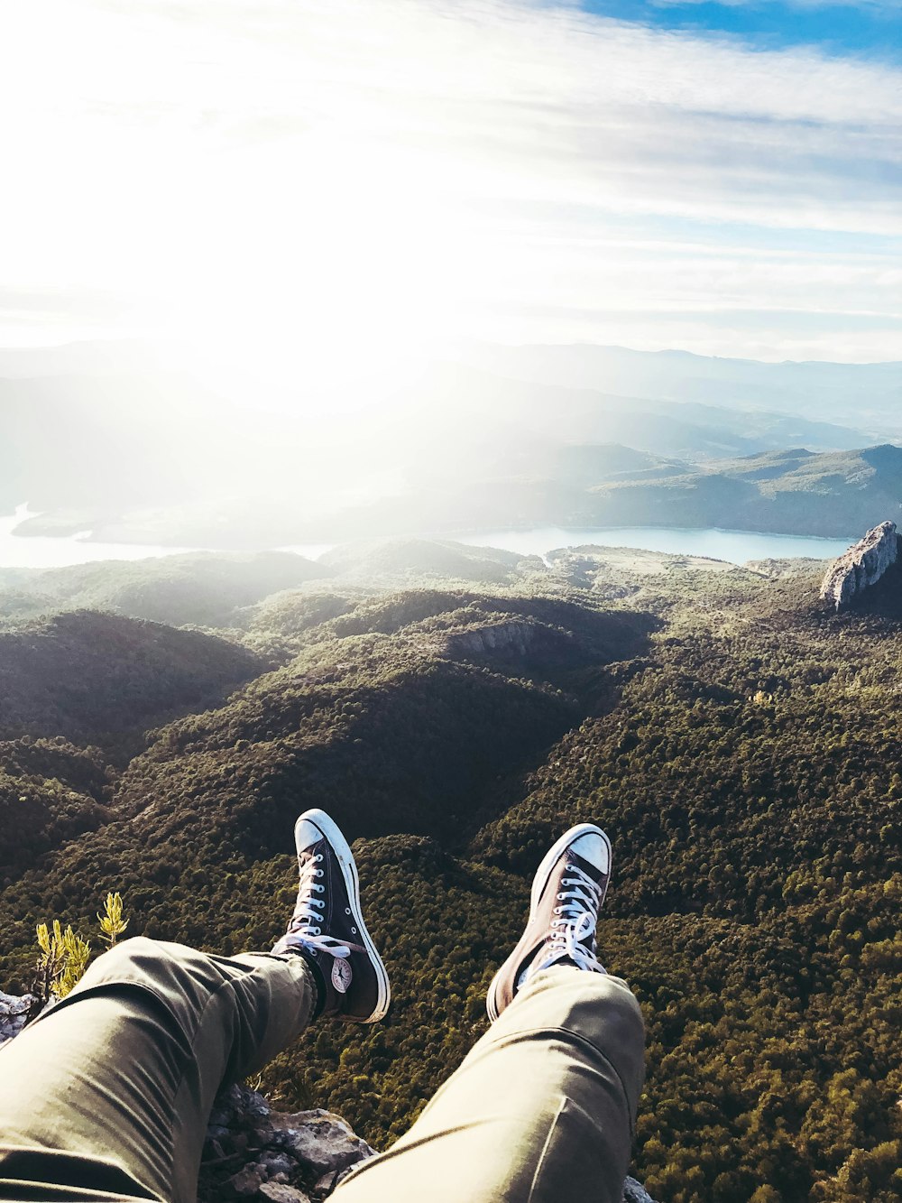 person sitting on top of hill