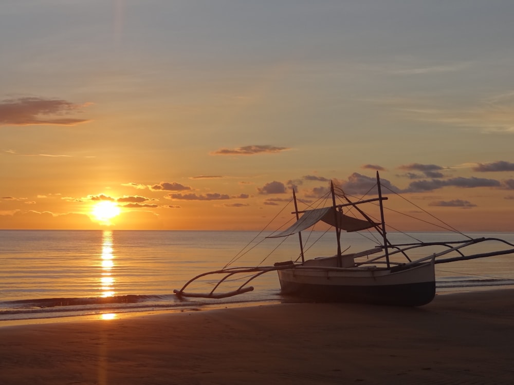 boat on shore during daytime