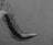 A curved skeletal structure that resembles a vertebral column extends across the image, hanging against a textured background. The monochrome color scheme emphasizes the intricate details of the bones, creating a dramatic visual contrast.