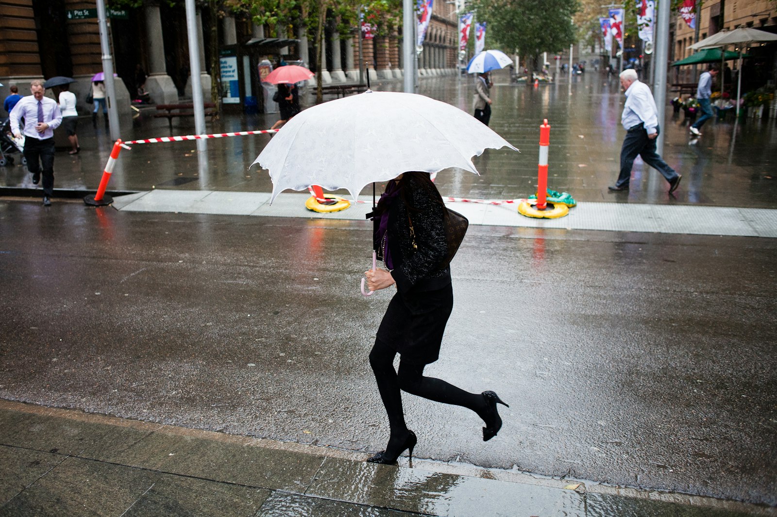 Canon EF 28mm F2.8 sample photo. Woman carrying white umbrella photography