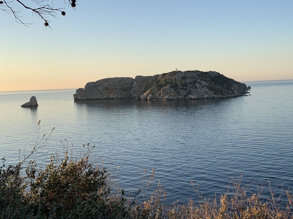 boulder on body of water