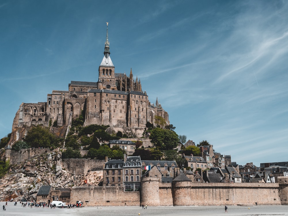 people standing beside castle