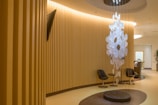 Reception area with warm lighting and natural decor elements welcoming guests.