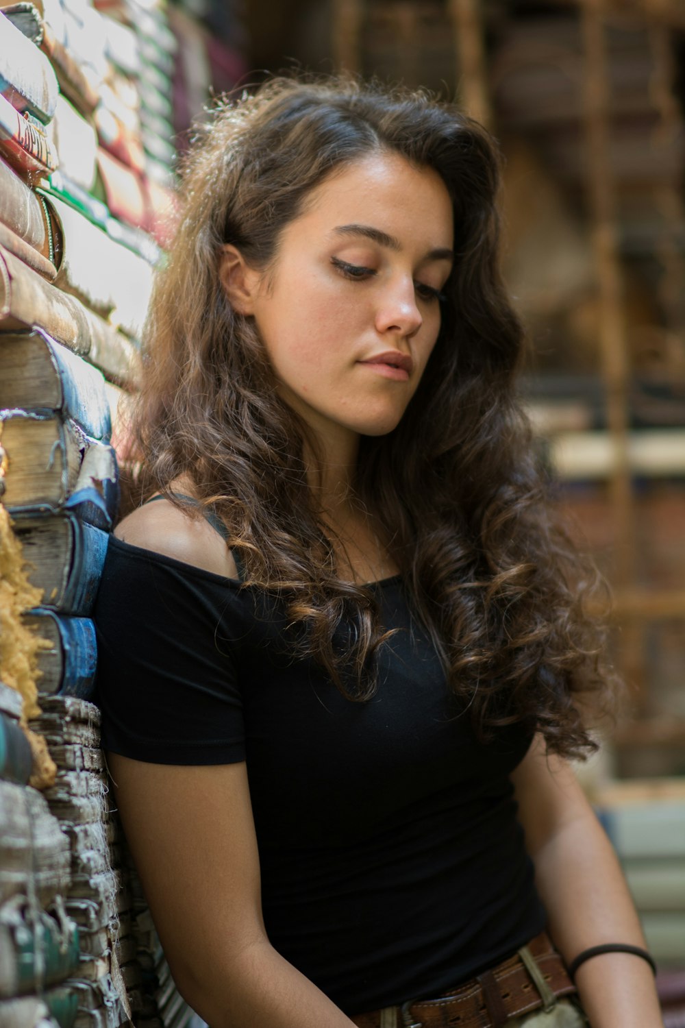 woman leaning on wall