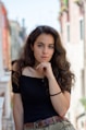 selective focus photography of woman wearing black off-shoulder blouse