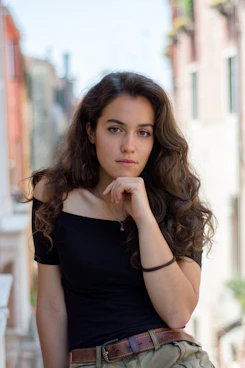 selective focus photography of woman wearing black off-shoulder blouse
