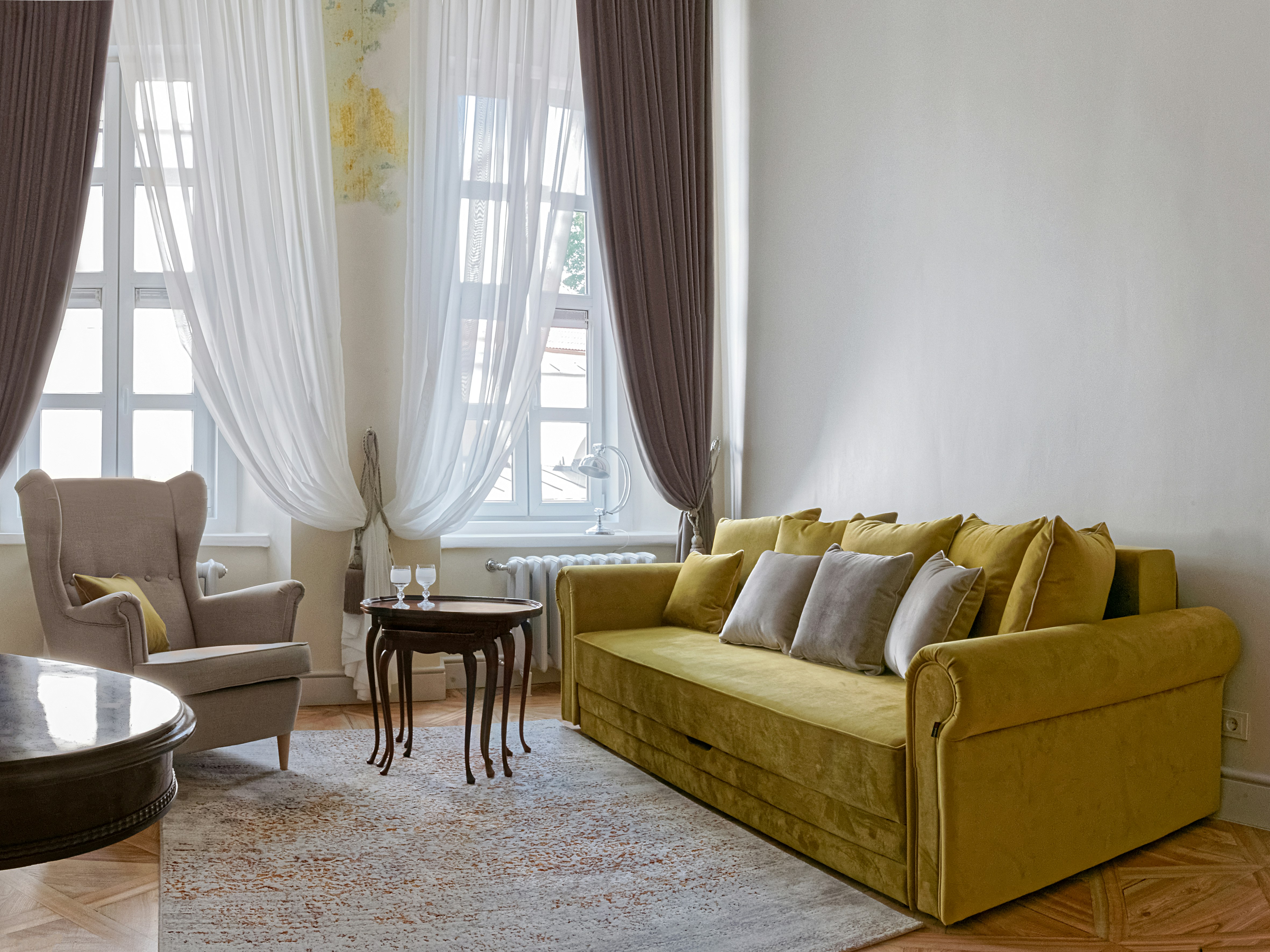 living room with a custom art piece and luxurious textures like velvet and silk - Luxury apartment designs