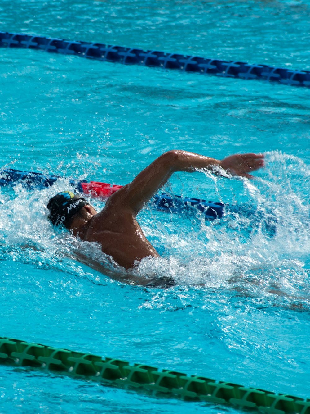man swimming in competition
