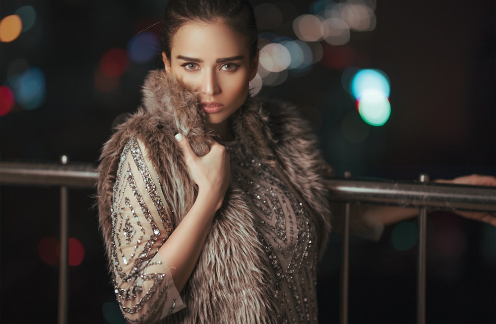 woman wearing brown coat