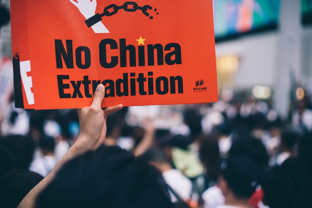 person holding no china extradition poster