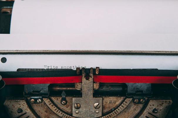 Close-up of a vintage typewriter with a fresh sheet of paper, ready for a new story to begin
