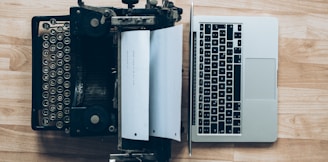 gray typewriter and MacBook