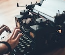 person using typewriter