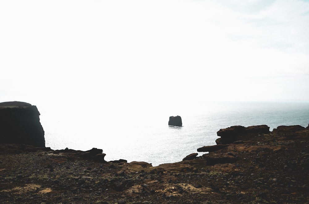 black boat surrounded by water