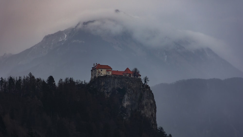 house on cliff during daytime