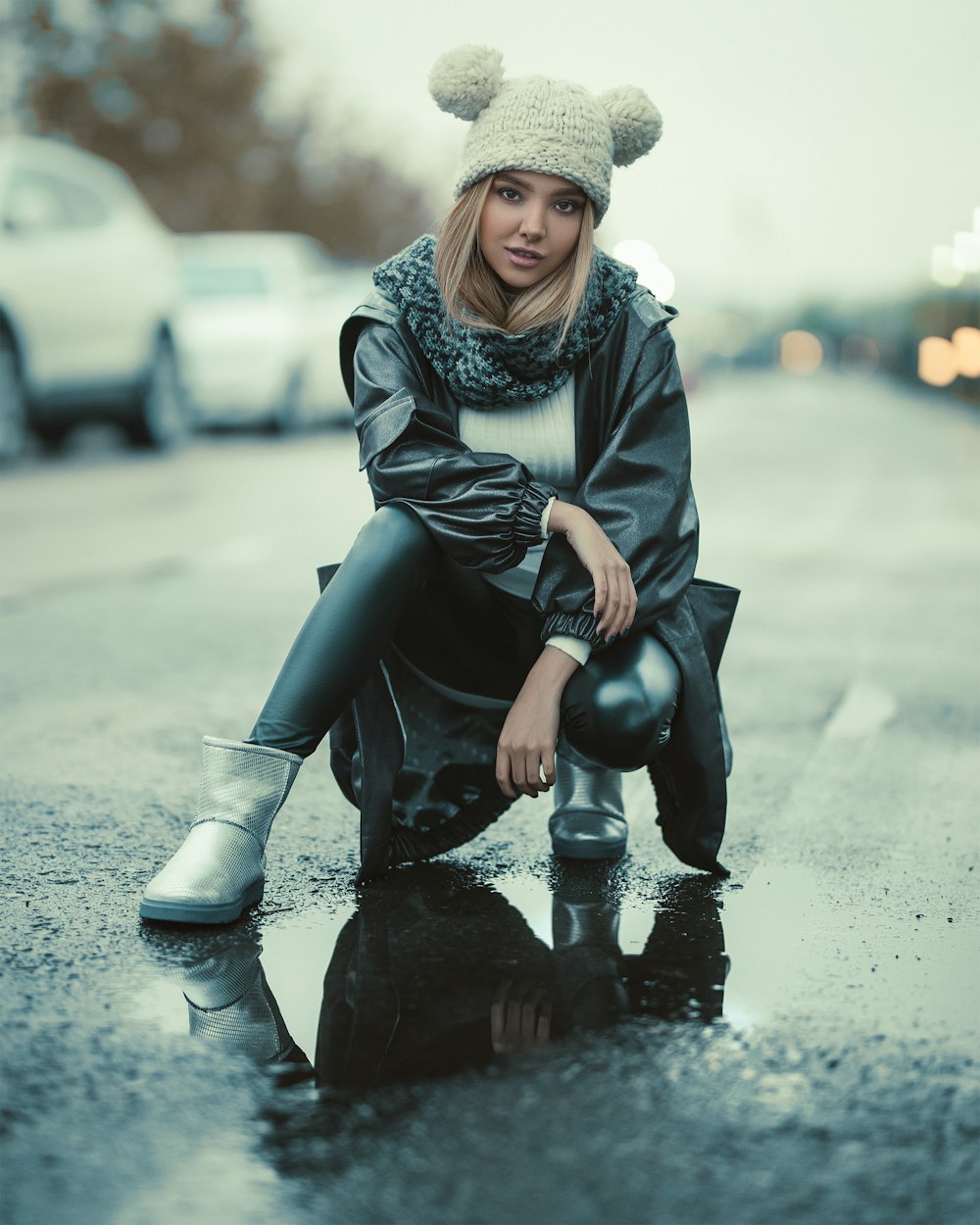 selective focus of woman wearing black leather topcoat