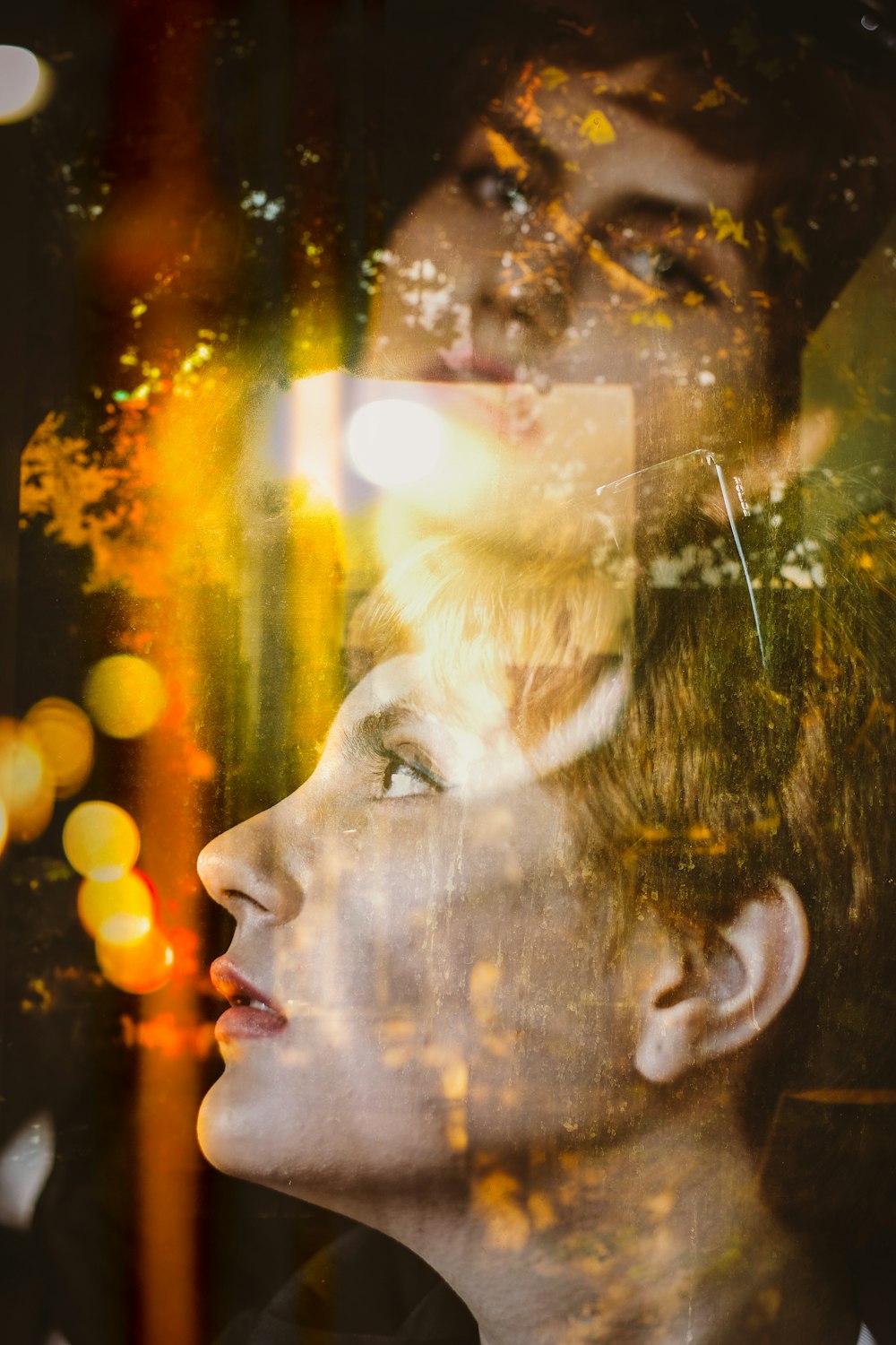 a double exposure of a man and a woman