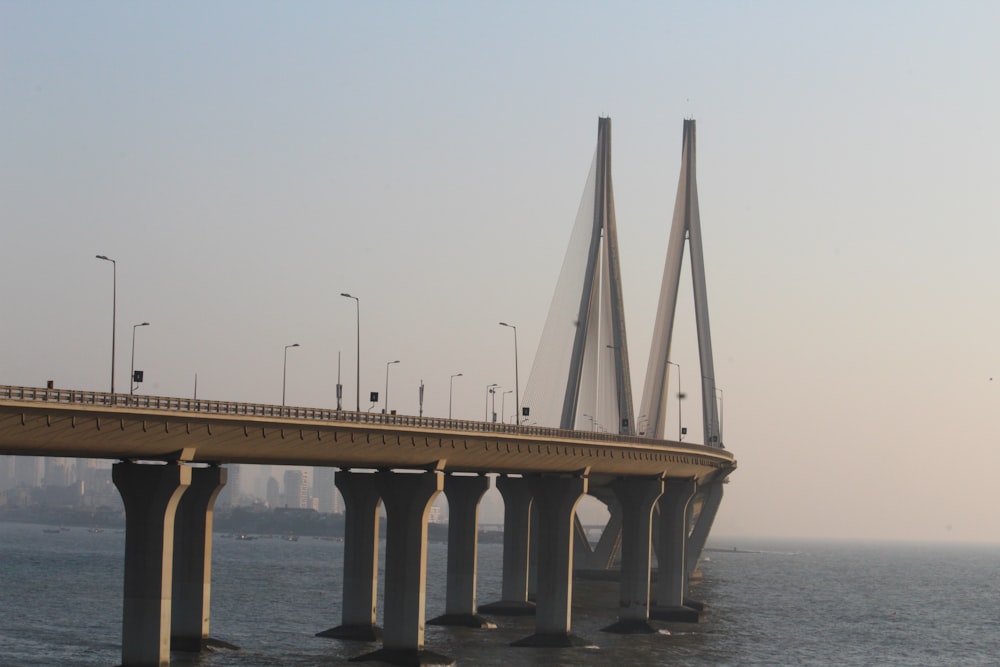 concrete bridge under gray sky