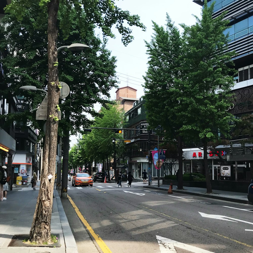 people and vehicles at the streets of the city during day