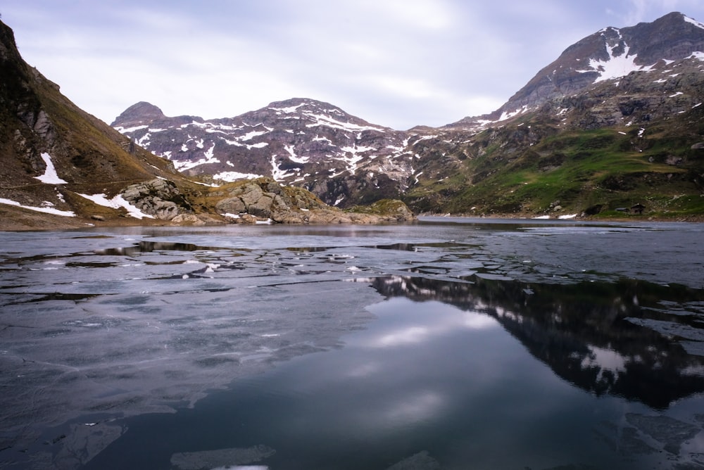 snow capped mountain under white clouds