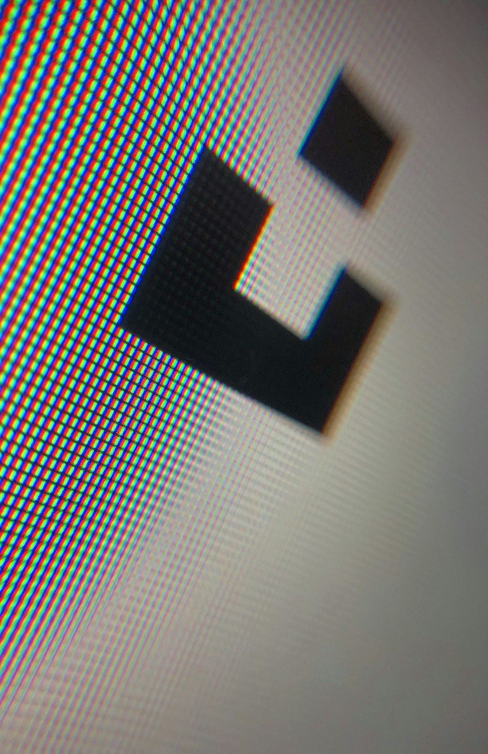 a blurry image of a computer screen with the letter e on it