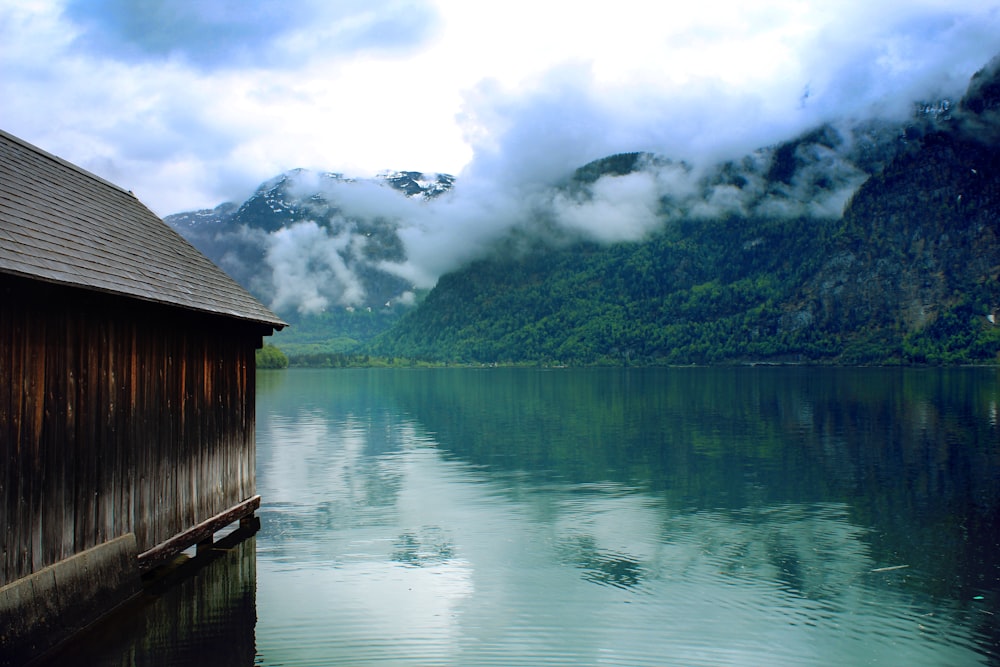 brown house beside body of water