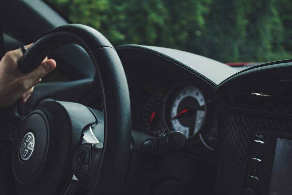 man driving vehicle during daytime