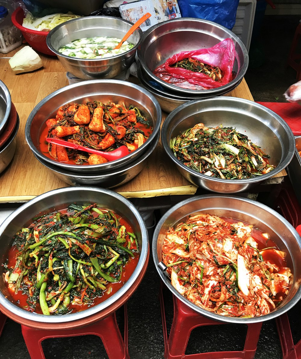 vegetable dishes in silver bowls