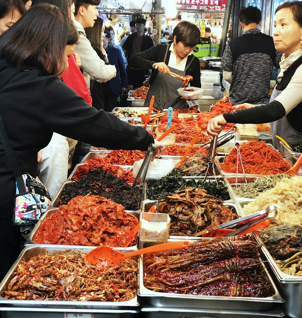 people buying and picking foods