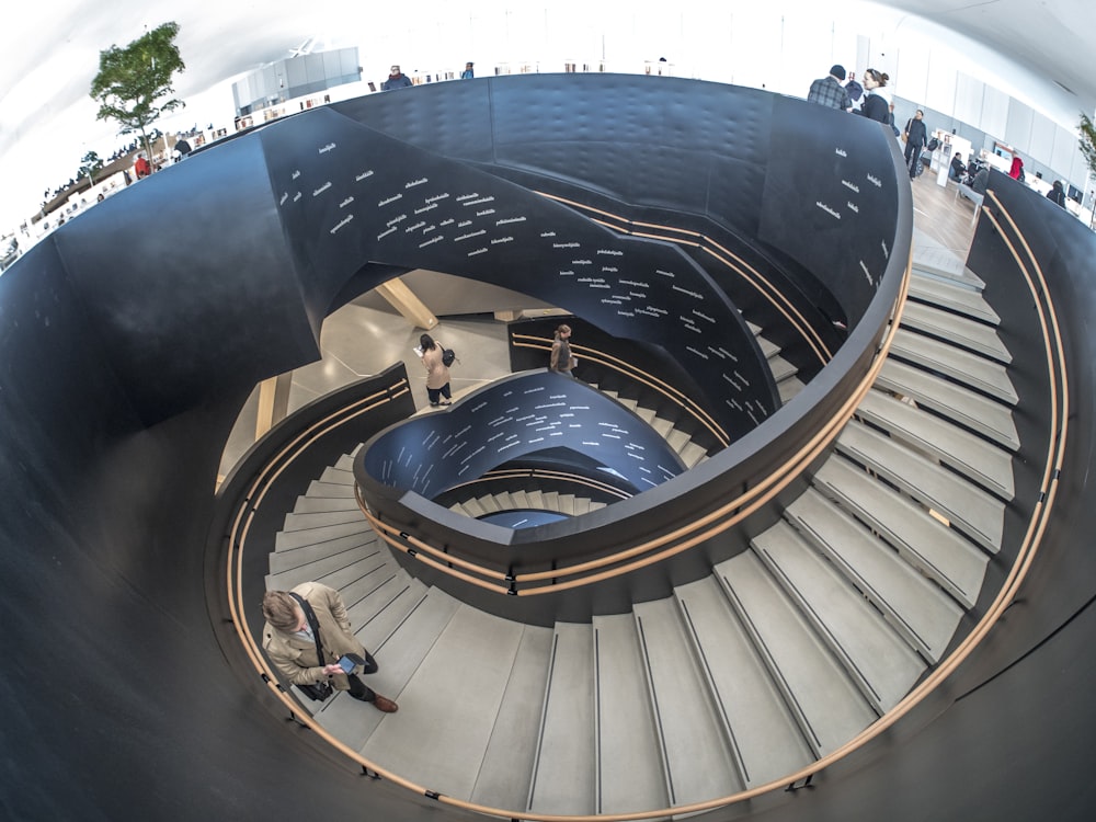 aerial photography of person walking on stairs