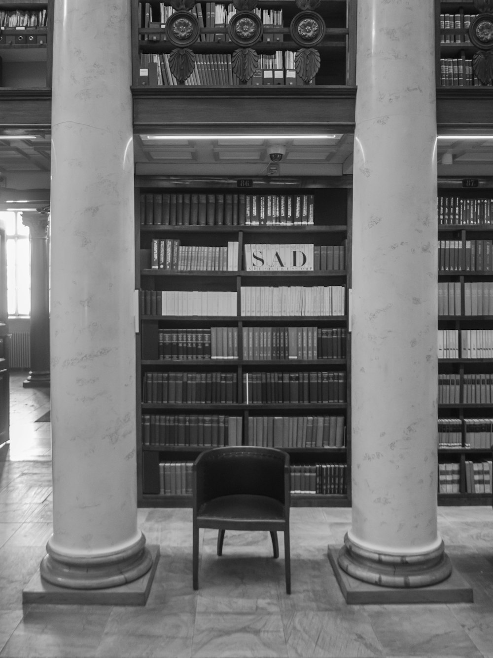 vacant black armchair in library