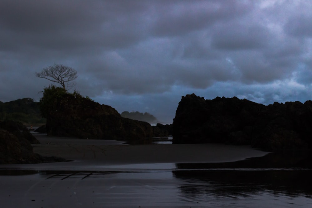 rock islands surrounded by body of water