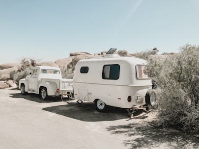 white vehicle parked near plant
