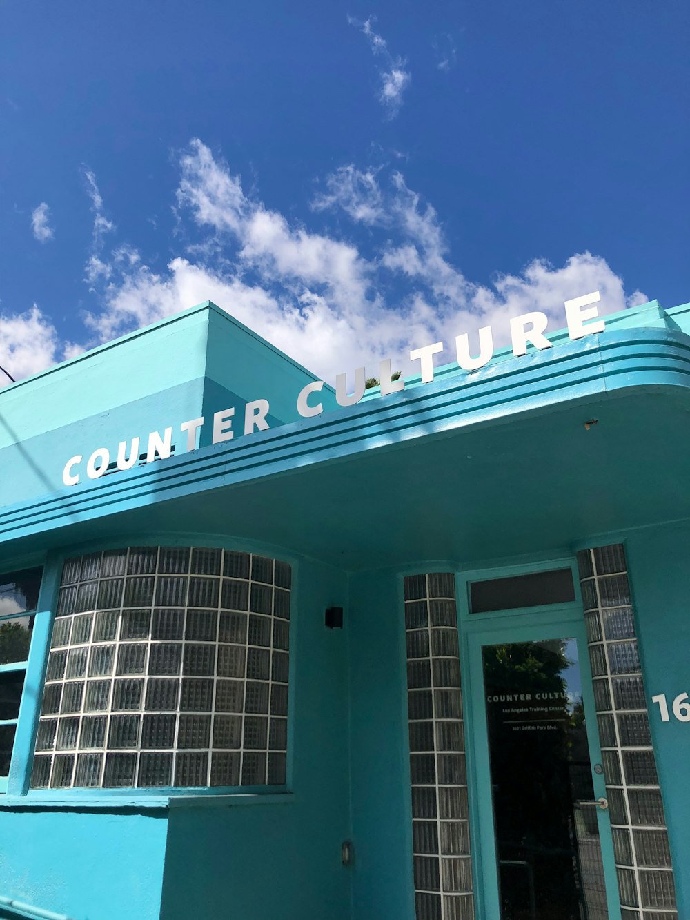 teal Counter Couture building under blue sky